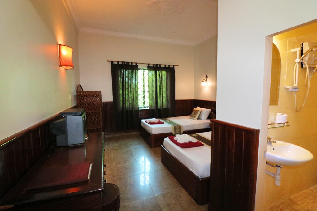 Firefly Guesthouse - The Berlin Angkor Siem Reap Værelse billede